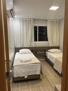 Postel nebo postele na pokoji v ubytování Lagoa EcoTowers Resort 5 Estrela