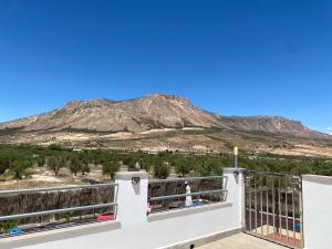 a balcony with a view of a mountain at Cortijo LOS MIRADORES in Vélez Blanco
