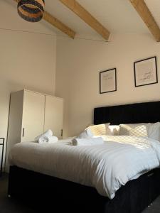 Ένα ή περισσότερα κρεβάτια σε δωμάτιο στο 3 Bed Barn in Cambridge next to Anglesey Abbey