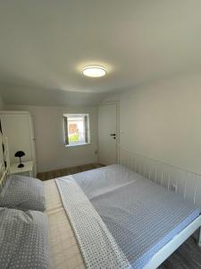 Postel nebo postele na pokoji v ubytování Balatura House