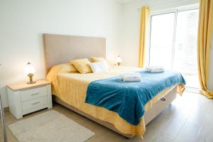 Postel nebo postele na pokoji v ubytování Marina Mar Vila Franca do Campo
