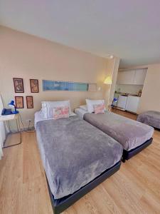 a bedroom with two beds in a room at Hotel Living 55 in Bogotá +24 photos