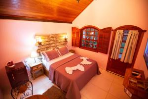 Postel nebo postele na pokoji v ubytování Chalé Lumiar Home & Pousada em Lagoa Santa - MG