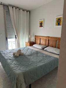 Ένα ή περισσότερα κρεβάτια σε δωμάτιο στο Riviera Ático