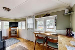 a kitchen with a table and chairs in a room at Lakefront Cabin Retreat (Cabin B) in Vallecito