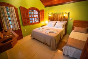 Postel nebo postele na pokoji v ubytování Chalé Lumiar Home & Pousada em Lagoa Santa - MG + 37 fotografií