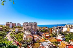 an aerial view of a city with buildings and the ocean at SOHO PV - 1007 Best and Brand New Condo in Puerto Vallarta