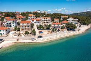 an aerial view of a town next to the water at Apartment Jezera 5109b in Jezera