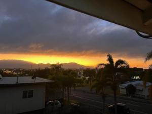 a sunset from the balcony of a house at Country Charmer On Albert in The Range