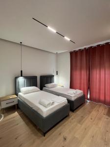 Postel nebo postele na pokoji v ubytování Vlora Sunset Rooms