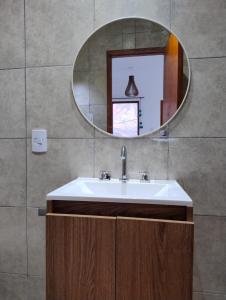 a bathroom with a sink and a mirror at El Alfarero de Maimará in Maimará +31 photos