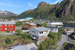 an aerial view of a small town with a mountain at Idyllisk enebolig! in Svolvær