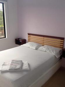 Postel nebo postele na pokoji v ubytování Hotel ZT