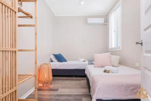 Ένα ή περισσότερα κρεβάτια σε δωμάτιο στο Oasis Two On Farnborough
