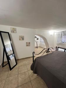 Ένα ή περισσότερα κρεβάτια σε δωμάτιο στο Barcaioli's Home