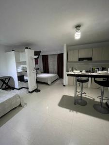 Voodi või voodid majutusasutuse Hotel Plaza Norte Cali toas