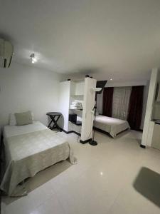 Voodi või voodid majutusasutuse Hotel Plaza Norte Cali toas