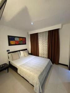 Voodi või voodid majutusasutuse Hotel Plaza Norte Cali toas