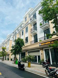 two motorcycles parked in front of a building at Vinh Home in Ðông Hà +42 photos