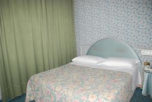 Postel nebo postele na pokoji v ubytování Hotel Il Burchiello