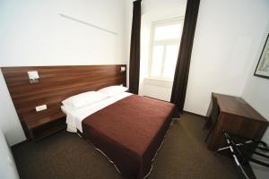 Postel nebo postele na pokoji v ubytování Riva Rooms