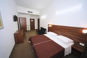 Кровать или кровати в номере Riva Rooms