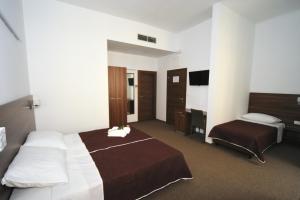 Postel nebo postele na pokoji v ubytování Riva Rooms