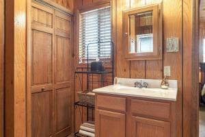a bathroom with a sink and a mirror at Grendel Grove Getaway in Innsbrook +19 photos