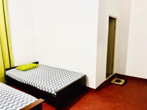 Letto o letti in una camera di Yu Home Stay Anuradhapura