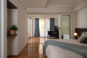 a bedroom with a bed and a desk in a room at Saigon Sky Garden Serviced Apartments in Ho Chi Minh City +89 photos
