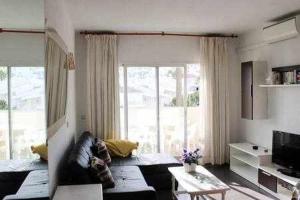A television and/or entertainment centre at Apartamento turístico S