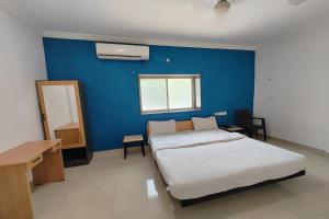 Postel nebo postele na pokoji v ubytování Hotel Sai Inn Executive