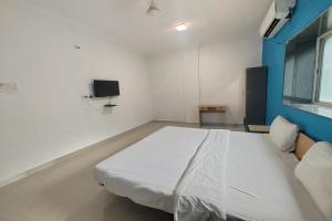 Postel nebo postele na pokoji v ubytování Hotel Sai Inn Executive