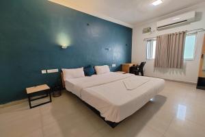 Postel nebo postele na pokoji v ubytování Hotel Sai Inn Executive