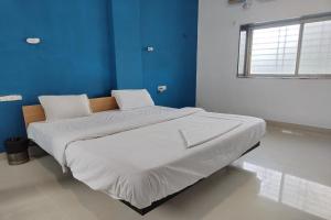 Postel nebo postele na pokoji v ubytování Hotel Sai Inn Executive
