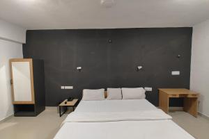 Postel nebo postele na pokoji v ubytování Hotel Sai Inn Executive