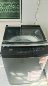 a toaster oven sitting on top of a counter at Happy inn home in Ipoh