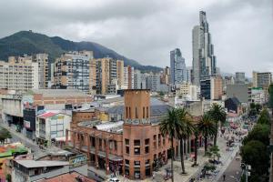 a city with tall buildings and a clock tower at Apartamento en el centro Bogotá in Bogotá