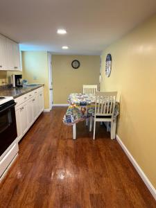 a kitchen with a table and a dining room at Sea Gem in Old Orchard Beach