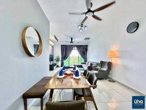 a living room with a table and a couch at Citywood by RR JBcity in Johor Bahru