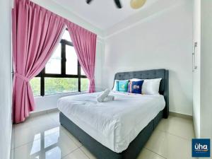 a bedroom with a bed with pink curtains and a window at Citywood by RR JBcity in Johor Bahru