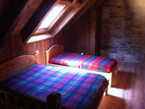 Postel nebo postele na pokoji v ubytování Gîtes Au Chant des Marmites