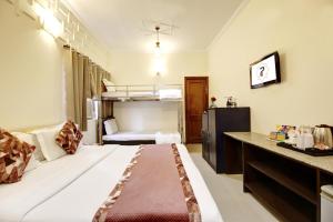 Postel nebo postele na pokoji v ubytování Persona International Hotel Karol Bagh Delhi