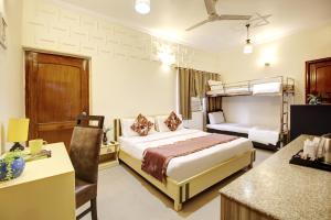 Postel nebo postele na pokoji v ubytování Persona International Hotel Karol Bagh Delhi