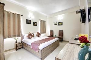 Postel nebo postele na pokoji v ubytování Persona International Hotel Karol Bagh Delhi