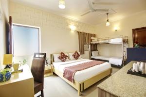 Postel nebo postele na pokoji v ubytování Persona International Hotel Karol Bagh Delhi + 37 fotografií