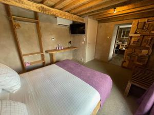 Postel nebo postele na pokoji v ubytování Les Chambres de Laurette