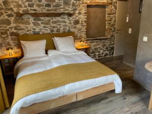 Postel nebo postele na pokoji v ubytování Les Chambres de Laurette