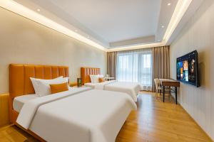 Televizorius ir (arba) pramogų centras apgyvendinimo įstaigoje Raffles Executive Apartment - Guangzhou Huijin International Finance Center, Keyun Road Metro Station Branch-Canton Fair Free Shuttle