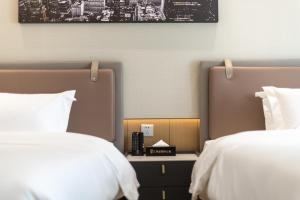 Lova arba lovos apgyvendinimo įstaigoje Raffles Executive Apartment - Guangzhou Huijin International Finance Center, Keyun Road Metro Station Branch-Canton Fair Free Shuttle